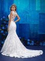 Stunning Allure Bridals 9422 is a mermaid silhouette, lace wedding gown with a beautiful sweetheart neckline. Boasting a stunning illusion back with button detail and and a chapel length train.