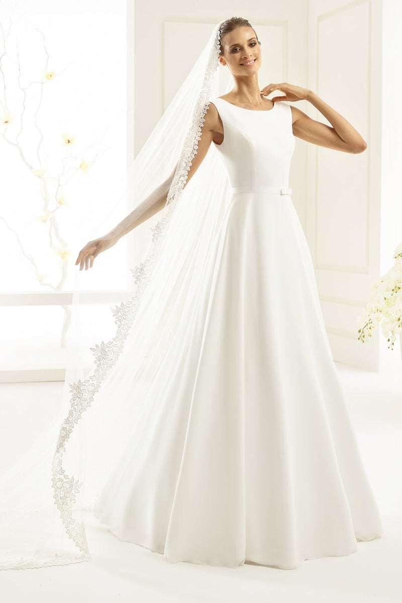 Bianco Evento Imperia is a simple yet elegant wedding dress, made from chiffon with a high front bateau neckline, a deep v-back and a chapel length train.