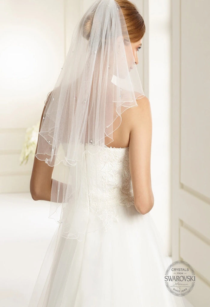 Bianco Evento Veil - S72 Double tiered veil with elegant corded edge. Attractive, tasteful design for the most beautiful day of your life. Tulle Type: Soft tulle,  length 80 cm / 60 cm. With 40 Swarovski crystal beads decorated by hand  Carefully designed and manufactured within the EU.