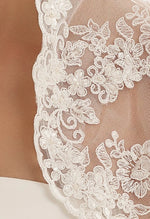 Bianco Evento Bolero E106 Chic lace bolero with 3/4 sleeves.  Lace decorated with hand attached small glass beads. Carefully designed and manufactured within the EU.