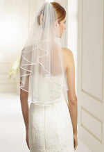 Bianco Evento Veil  - S6 Single layered veil with satin edge Soft tulle Length 28 inch Veil will be delivered with the comb already attached Designed and manufactured in Europe