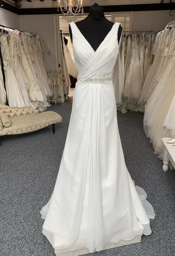Alexia Designs  FY6216, gorgeous wrap style, chiffon wedding gown. Stunning a-line sillhouette with an intricate, beaded waist detail.