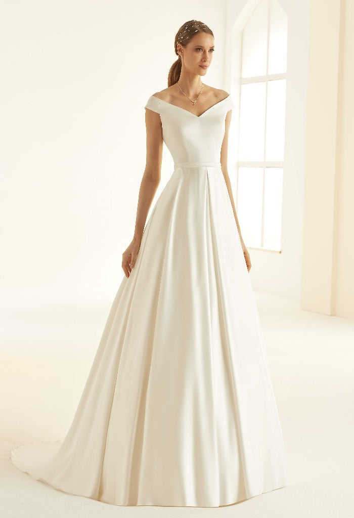 Bianco Evento Esmerelda high-quality satin wedding gown with a wonderfully shaped bodice, a-line skirt and drop sleeves. It has a discrete back-zip fastening, low back and chapel length train