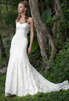 Augusta Jones Jessie is a romantic, mermaid silhouette wedding gown with a chapel length train. A beautiful strapless ivory, beaded lace gown, and a delicate scalloped, sweetheart neckline.